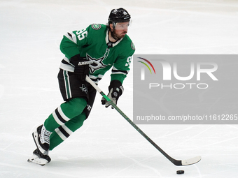 Matt Duchene #95 of the Dallas Stars skates up the ice while controlling the puck during the NHL preseason match between the Dallas Stars an...