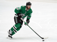 Matt Duchene #95 of the Dallas Stars skates up the ice while controlling the puck during the NHL preseason match between the Dallas Stars an...