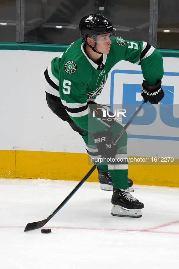 Nils Lundkvist #5 of the Dallas Stars skates up the ice while controlling the puck during the NHL preseason match between the Dallas Stars a...