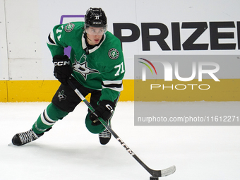 Antonio Stranges #71 of the Dallas Stars skates up the ice while controlling the puck during the NHL preseason match between the Dallas Star...