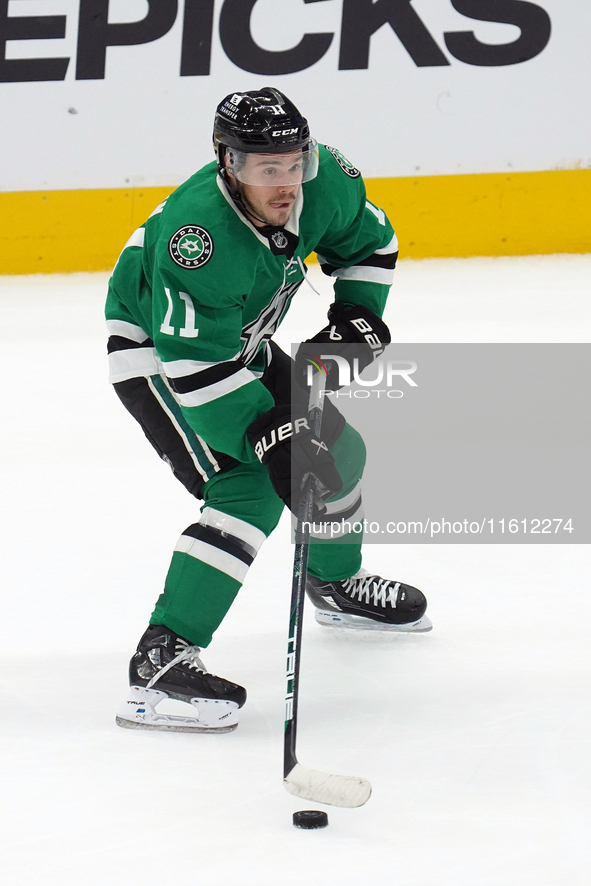 Logan Stankoven #11 of the Dallas Stars skates up the ice while controlling the puck during the NHL preseason match between the Dallas Stars...