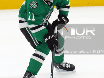 Logan Stankoven #11 of the Dallas Stars skates up the ice while controlling the puck during the NHL preseason match between the Dallas Stars...