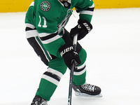 Logan Stankoven #11 of the Dallas Stars skates up the ice while controlling the puck during the NHL preseason match between the Dallas Stars...