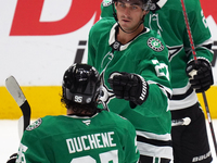 Mason Marchment #27 of the Dallas Stars is congratulated by Matt Duchene #95 after scoring a goal during the NHL preseason match between the...