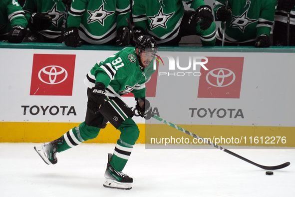 Tyler Seguin #91 of the Dallas Stars skates up the ice while controlling the puck during the NHL preseason match between the Dallas Stars an...