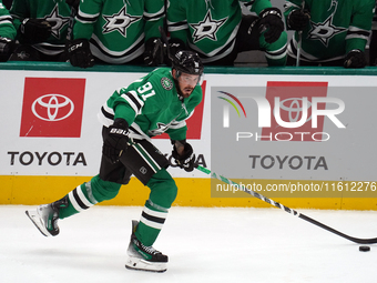 Tyler Seguin #91 of the Dallas Stars skates up the ice while controlling the puck during the NHL preseason match between the Dallas Stars an...