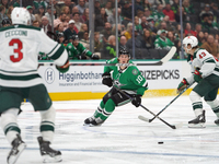 Oskar Back #10 of the Dallas Stars controls the puck during the NHL preseason match between the Dallas Stars and the Minnesota Wild at Ameri...