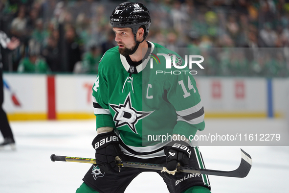 Jamie Benn #14 of the Dallas Stars skates up the ice during the NHL preseason match between the Dallas Stars and the Minnesota Wild at Ameri...