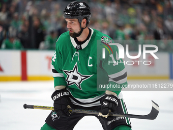 Jamie Benn #14 of the Dallas Stars skates up the ice during the NHL preseason match between the Dallas Stars and the Minnesota Wild at Ameri...