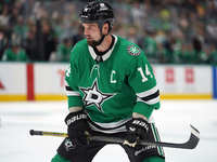 Jamie Benn #14 of the Dallas Stars skates up the ice during the NHL preseason match between the Dallas Stars and the Minnesota Wild at Ameri...