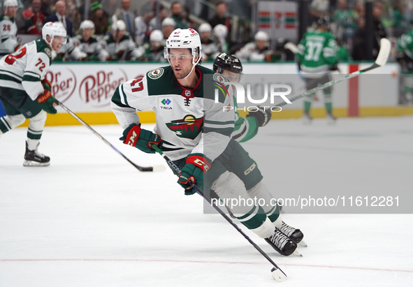 Declan Chisholm #47 of the Minnesota Wild controls the puck during the NHL preseason match between the Dallas Stars and the Minnesota Wild a...