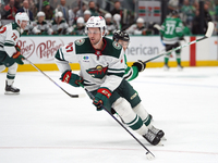 Declan Chisholm #47 of the Minnesota Wild controls the puck during the NHL preseason match between the Dallas Stars and the Minnesota Wild a...