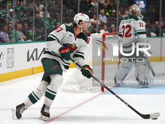 Declan Chisholm #47 of the Minnesota Wild controls the puck during the NHL preseason match between the Dallas Stars and the Minnesota Wild a...