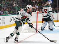 Declan Chisholm #47 of the Minnesota Wild controls the puck during the NHL preseason match between the Dallas Stars and the Minnesota Wild a...