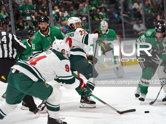 Marat Khusnutdinov #22 of the Minnesota Wild plays the puck during the NHL preseason match between the Dallas Stars and the Minnesota Wild a...