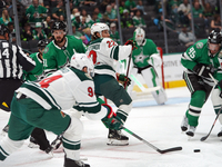 Marat Khusnutdinov #22 of the Minnesota Wild plays the puck during the NHL preseason match between the Dallas Stars and the Minnesota Wild a...