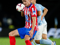 Alexander Sorloth (L) of Atletico de Madrid fights for the ball with Fran Beltran (R) of RC Celta de Vigo during the LaLIGA EA SPORTS match...