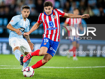 Julian Alvarez (R) of Atletico de Madrid fights for the ball with Fran Beltran (L) of RC Celta de Vigo during the LaLIGA EA SPORTS match bet...