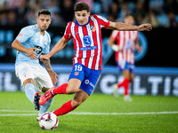 Julian Alvarez (R) of Atletico de Madrid fights for the ball with Fran Beltran (L) of RC Celta de Vigo during the LaLIGA EA SPORTS match bet...