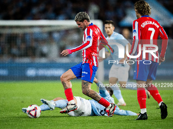 Rodrigo De Paul of Atletico de Madrid fights for the ball with Tasos Douvikas of RC Celta de Vigo during the LaLIGA EA SPORTS match between...