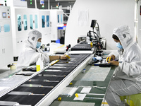 Workers at a liquid crystal display manufacturer work at Shanting Economic Development Zone in Zaozhuang, China, on September 25, 2024. (