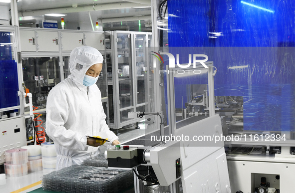 Workers at a liquid crystal display manufacturer work at Shanting Economic Development Zone in Zaozhuang, China, on September 25, 2024. 