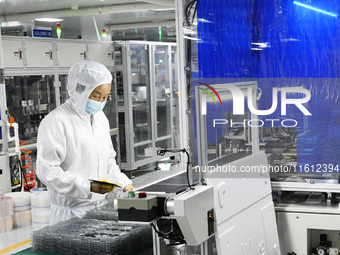 Workers at a liquid crystal display manufacturer work at Shanting Economic Development Zone in Zaozhuang, China, on September 25, 2024. (