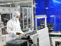 Workers at a liquid crystal display manufacturer work at Shanting Economic Development Zone in Zaozhuang, China, on September 25, 2024. (