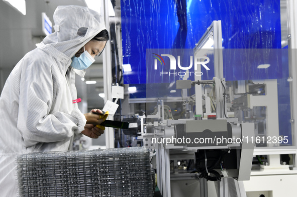 Workers at a liquid crystal display manufacturer work at Shanting Economic Development Zone in Zaozhuang, China, on September 25, 2024. 