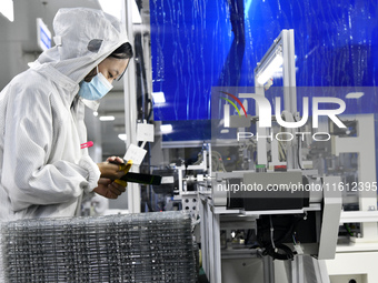 Workers at a liquid crystal display manufacturer work at Shanting Economic Development Zone in Zaozhuang, China, on September 25, 2024. (