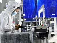 Workers at a liquid crystal display manufacturer work at Shanting Economic Development Zone in Zaozhuang, China, on September 25, 2024. (