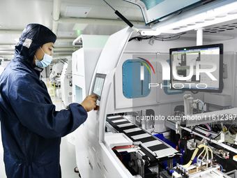 Workers at a liquid crystal display manufacturer work at Shanting Economic Development Zone in Zaozhuang, China, on September 25, 2024. (