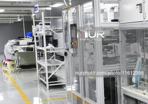 Workers at a liquid crystal display manufacturer work at Shanting Economic Development Zone in Zaozhuang, China, on September 25, 2024. 