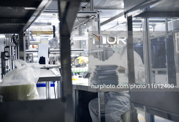 Workers at a liquid crystal display manufacturer work at Shanting Economic Development Zone in Zaozhuang, China, on September 25, 2024. 