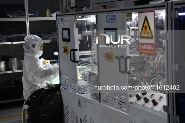 Workers at a liquid crystal display manufacturer work at Shanting Economic Development Zone in Zaozhuang, China, on September 25, 2024. 