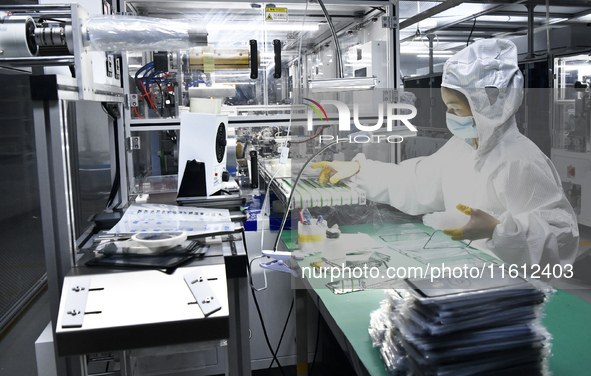 Workers at a liquid crystal display manufacturer work at Shanting Economic Development Zone in Zaozhuang, China, on September 25, 2024. 