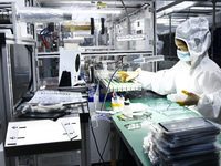 Workers at a liquid crystal display manufacturer work at Shanting Economic Development Zone in Zaozhuang, China, on September 25, 2024. (