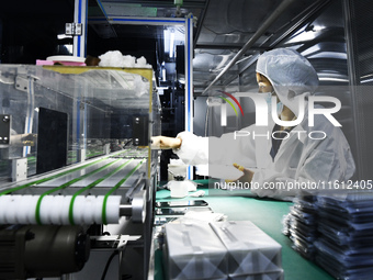 Workers at a liquid crystal display manufacturer work at Shanting Economic Development Zone in Zaozhuang, China, on September 25, 2024. (