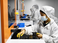 Workers at a liquid crystal display manufacturer work at Shanting Economic Development Zone in Zaozhuang, China, on September 25, 2024. (