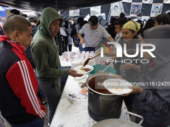 Normalista students accompany the mothers and fathers of the 43 missing Ayotzinapa students in Mexico City, Mexico, on September 26, 2024, a...