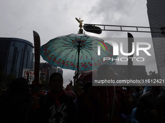 Mothers and fathers of the 43 missing Ayotzinapa students march from the Angel of Independence to the Zocalo in Mexico City, Mexico, on Sept...