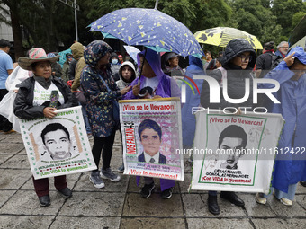 Mothers and fathers of the 43 missing Ayotzinapa students march from the Angel of Independence to the Zocalo in Mexico City, Mexico, on Sept...