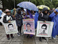 Mothers and fathers of the 43 missing Ayotzinapa students march from the Angel of Independence to the Zocalo in Mexico City, Mexico, on Sept...