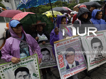 Mothers and fathers of the 43 missing Ayotzinapa students march from the Angel of Independence to the Zocalo in Mexico City, Mexico, on Sept...