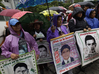 Mothers and fathers of the 43 missing Ayotzinapa students march from the Angel of Independence to the Zocalo in Mexico City, Mexico, on Sept...