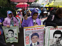 Mothers and fathers of the 43 missing Ayotzinapa students march from the Angel of Independence to the Zocalo in Mexico City, Mexico, on Sept...