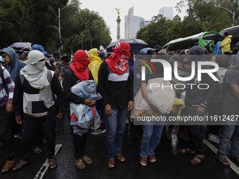 Normalista students accompany the mothers and fathers of the 43 missing Ayotzinapa students in Mexico City, Mexico, on September 26, 2024, a...