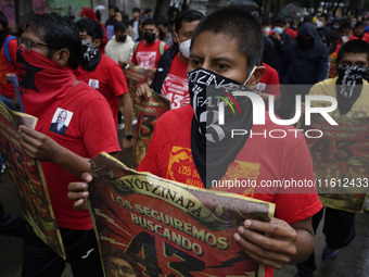 Normalista students accompany the mothers and fathers of the 43 missing Ayotzinapa students in Mexico City, Mexico, on September 26, 2024, a...