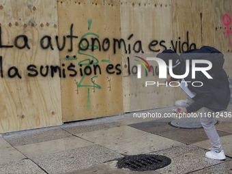 Members of the anarchist Black Bloc carry out direct action while accompanying the mothers and fathers of the 43 disappeared Ayotzinapa stud...