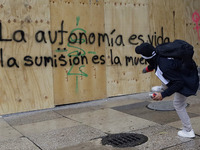 Members of the anarchist Black Bloc carry out direct action while accompanying the mothers and fathers of the 43 disappeared Ayotzinapa stud...